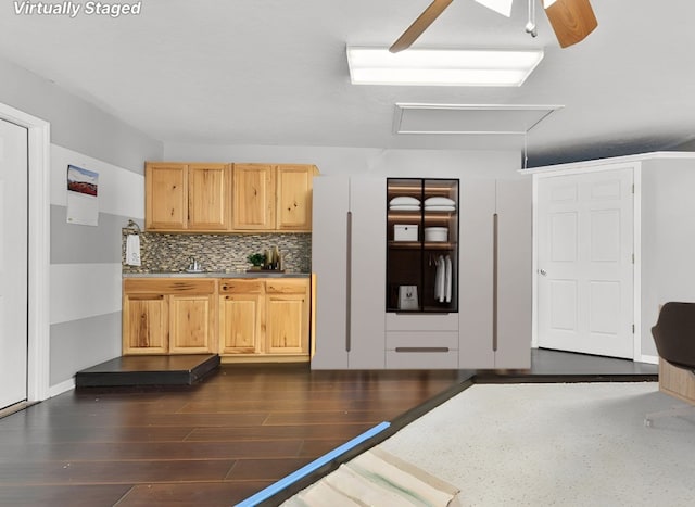 kitchen with decorative backsplash, dark hardwood / wood-style flooring, light brown cabinetry, and ceiling fan