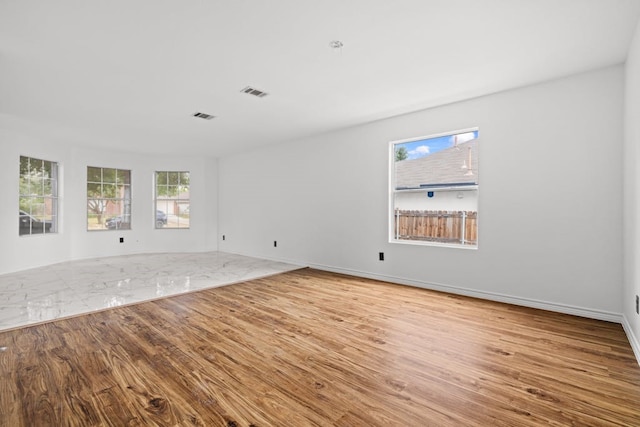 unfurnished room featuring light hardwood / wood-style flooring