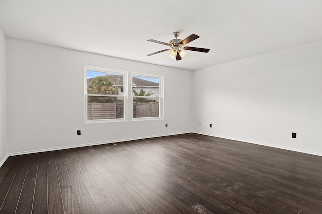 empty room featuring dark hardwood / wood-style floors and ceiling fan