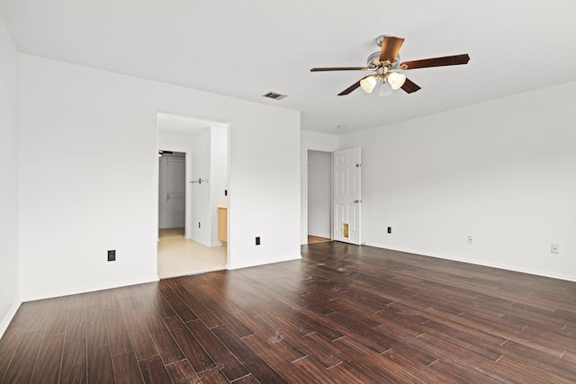 empty room with dark wood-type flooring and ceiling fan