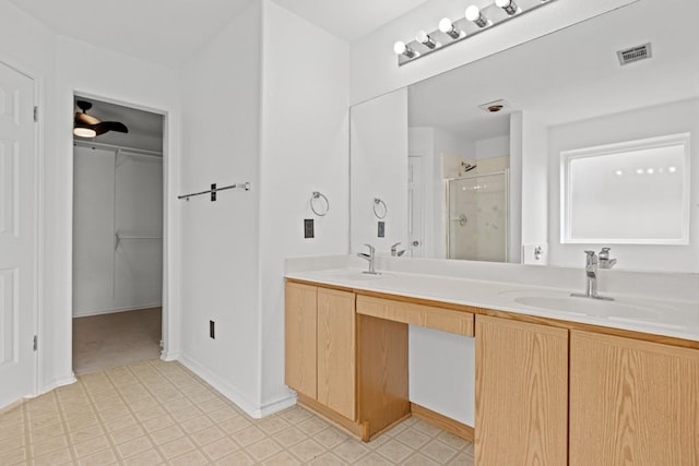 bathroom with an enclosed shower and vanity