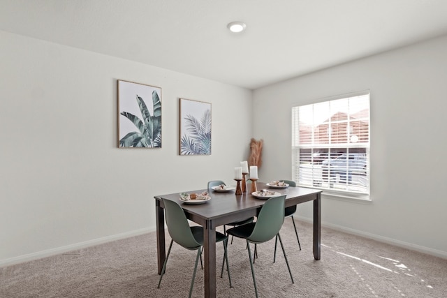 view of carpeted dining space