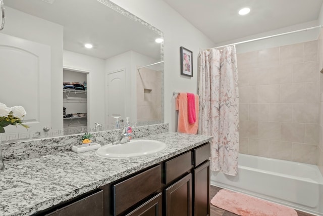 bathroom with vanity and shower / bathtub combination with curtain