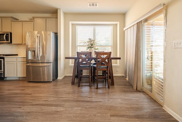 dining room with hardwood / wood-style floors