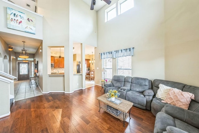 living room featuring ceiling fan and wood-type flooring