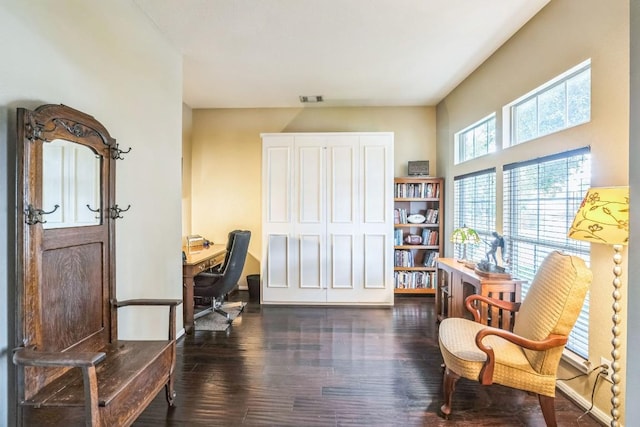 office space with dark wood-type flooring