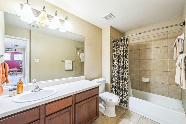 full bathroom featuring shower / tub combo with curtain, vanity, toilet, and tile patterned flooring