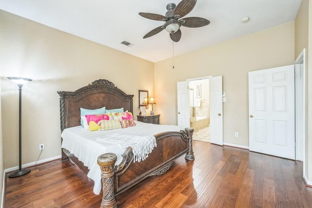 bedroom with ceiling fan, dark hardwood / wood-style floors, and ensuite bath