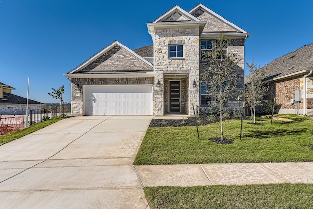 view of front of home with a garage and a front yard