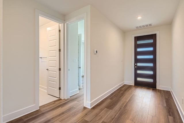 entryway with wood-type flooring