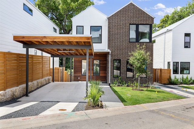 contemporary house featuring a carport