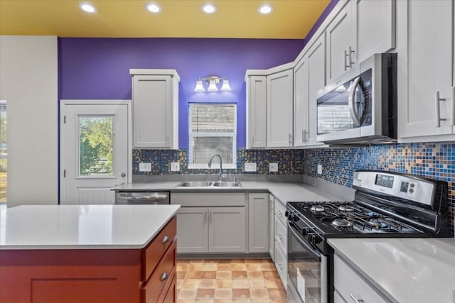 kitchen featuring backsplash, sink, and stainless steel appliances