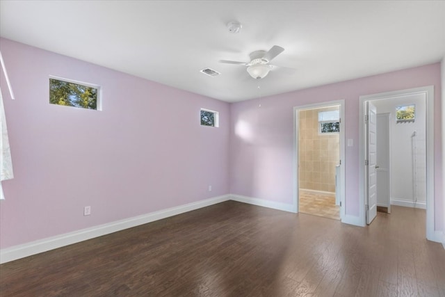 unfurnished room with plenty of natural light, hardwood / wood-style flooring, and ceiling fan