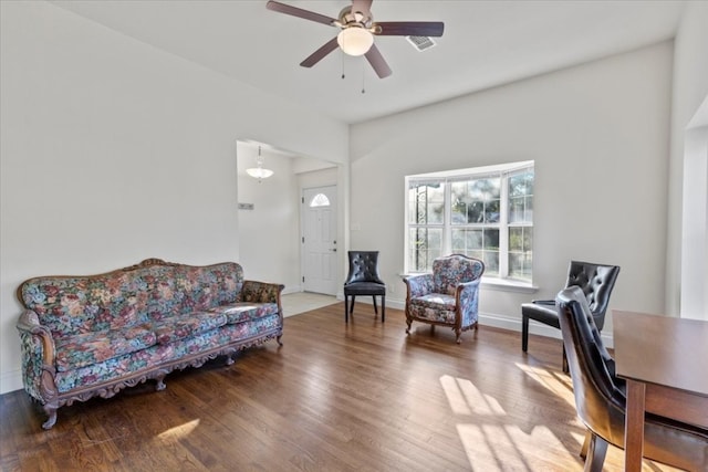 living room with hardwood / wood-style floors and ceiling fan