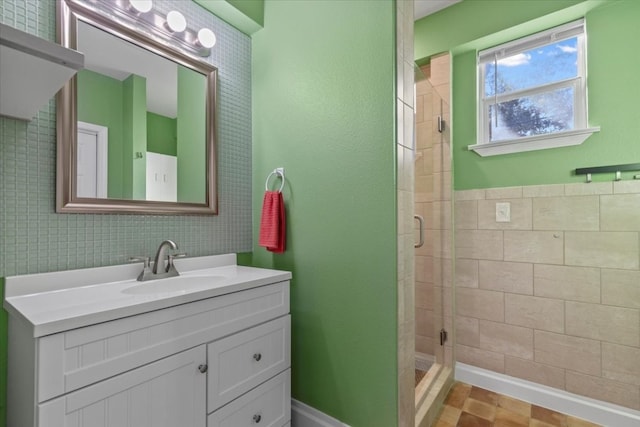 bathroom with vanity and a shower with shower door