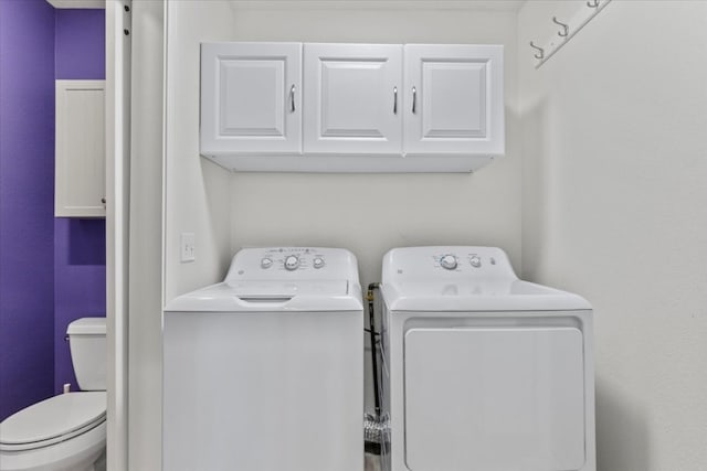 laundry area with cabinets and washer and dryer