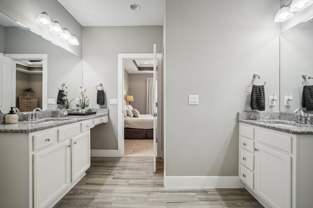 bathroom featuring vanity and hardwood / wood-style flooring