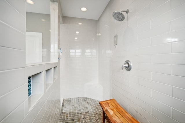 bathroom with a tile shower