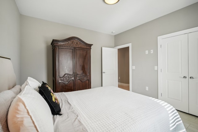 bedroom with a closet and light wood-type flooring