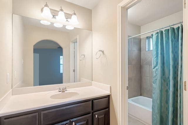 full bathroom featuring shower / bath combo and vanity