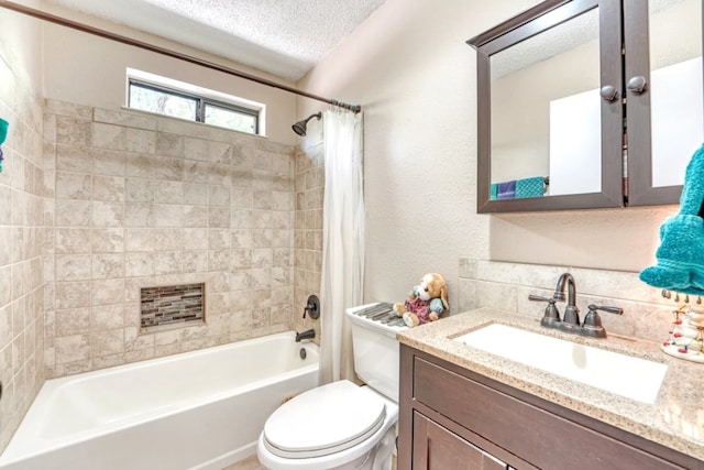 full bathroom with shower / bathtub combination with curtain, vanity, toilet, and a textured ceiling