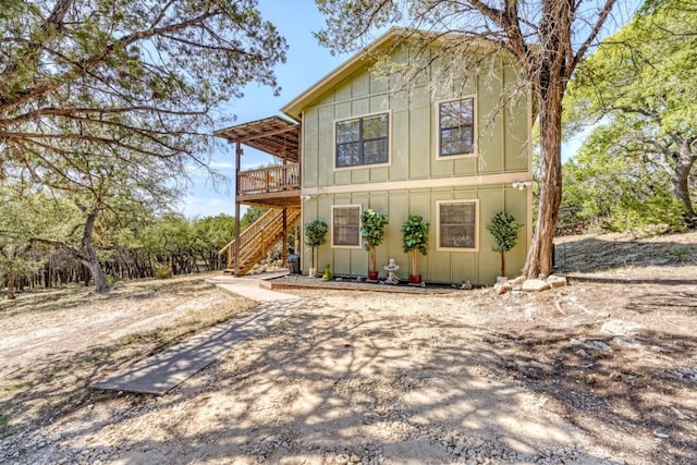 view of property featuring a wooden deck