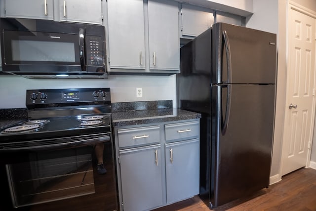 kitchen with white cabinets, gray cabinets, dark hardwood / wood-style floors, and black appliances