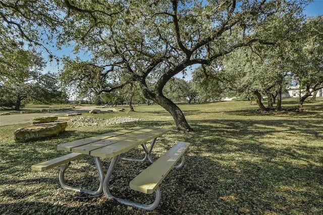 view of property's community with a yard