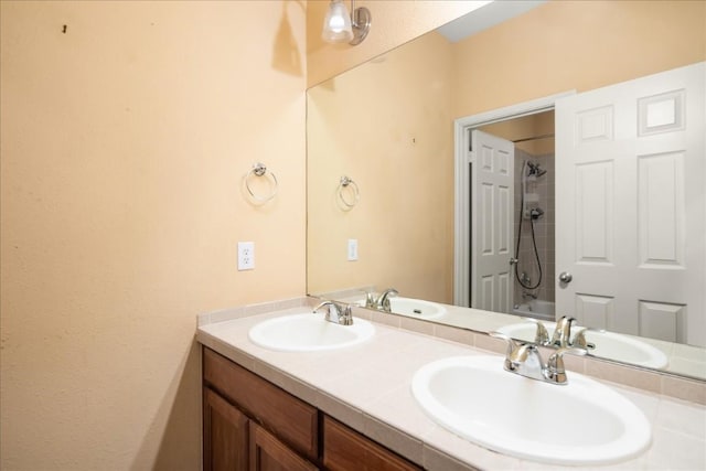 full bathroom with a sink and double vanity