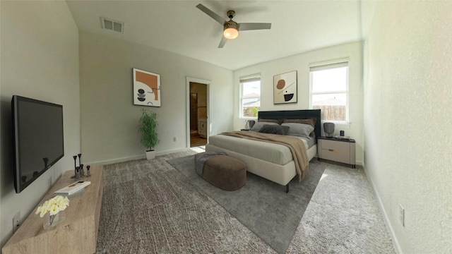 bedroom featuring carpet, ceiling fan, and ensuite bath