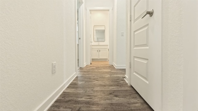 corridor featuring dark hardwood / wood-style flooring