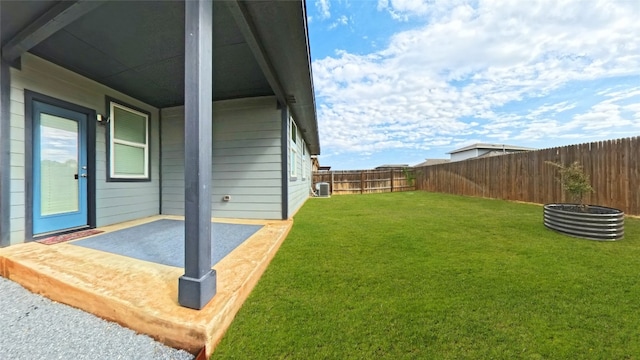 view of yard with central AC unit