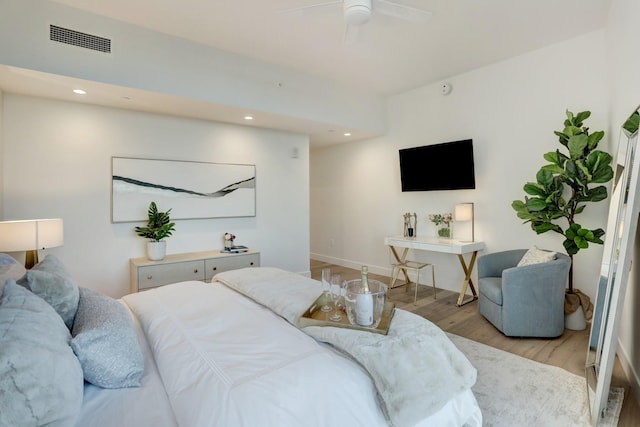 bedroom with light wood-type flooring and ceiling fan