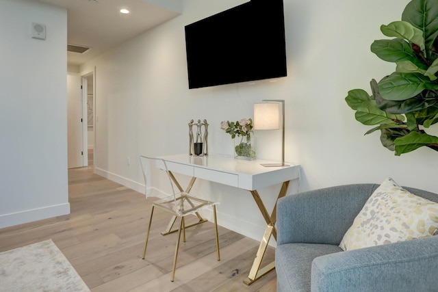 office area with light hardwood / wood-style flooring