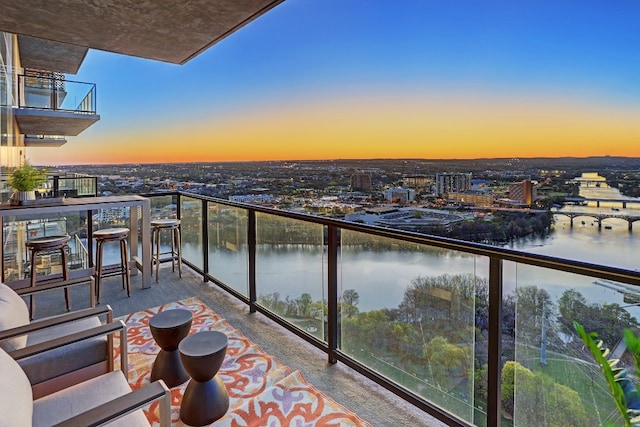 balcony at dusk with a water view