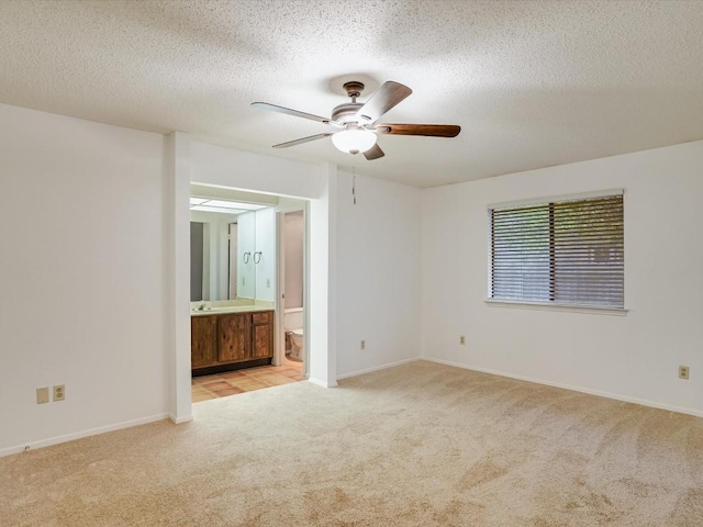 3606 Lovage Dr, Austin, TX 78727 - spare room featuring carpet floors, ceiling fan, and a textured ceiling