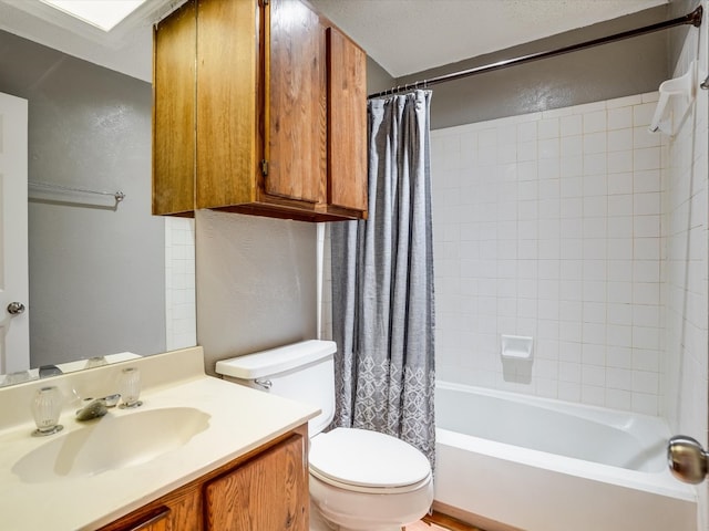 full bathroom featuring vanity, a textured ceiling, toilet, and shower / tub combo