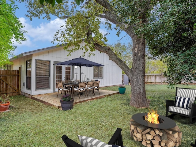3606 Lovage Dr, Austin, TX 78727 - fenced backyard with a fire pit and a wooden deck