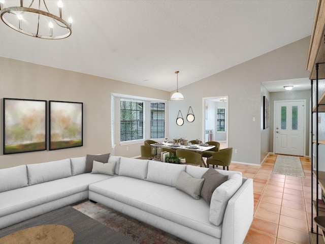 3606 Lovage Dr, Austin, TX 78727 - living area featuring lofted ceiling, light tile patterned floors, and a chandelier