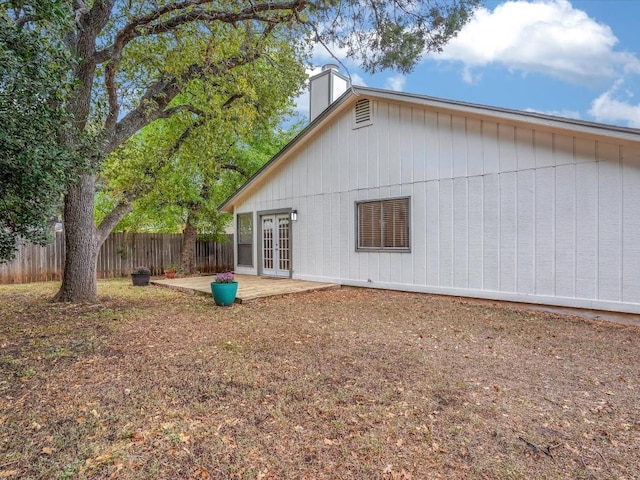 3606 Lovage Dr, Austin, TX 78727 - back of house with french doors, a patio area, and a chimney