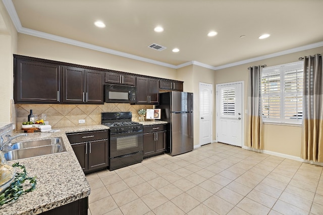 kitchen with black appliances, sink, ornamental molding, tasteful backsplash, and dark brown cabinetry