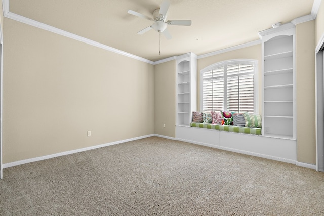 empty room with carpet floors, ceiling fan, and ornamental molding