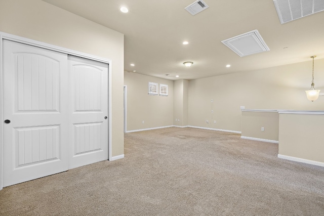 basement featuring light carpet