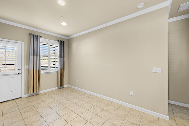 tiled empty room featuring ornamental molding