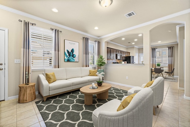 tiled living room featuring ornamental molding