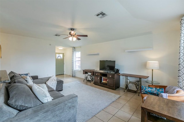 living room featuring ceiling fan and light tile patterned floors