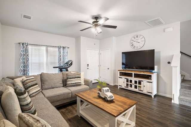 living room with ceiling fan and dark hardwood / wood-style floors