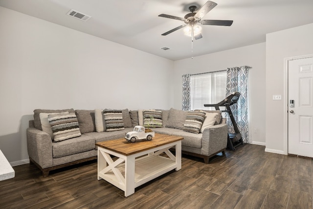 living room with ceiling fan and dark hardwood / wood-style floors