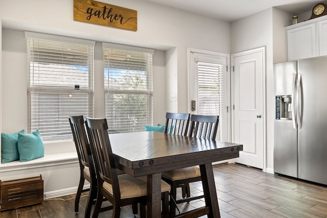 dining area with dark wood-type flooring