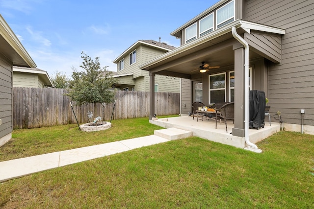 view of yard with a patio and ceiling fan